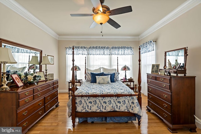 bedroom featuring crown molding, ceiling fan, and light hardwood / wood-style flooring