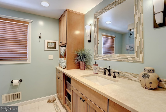 bathroom with vanity, tile patterned floors, and decorative backsplash