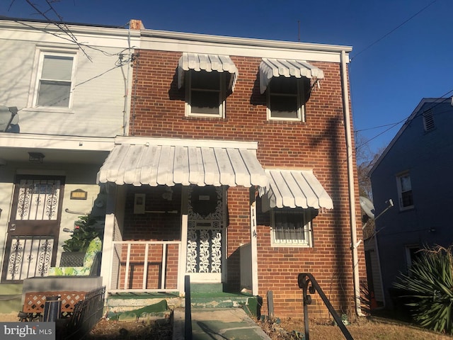 townhome / multi-family property with covered porch