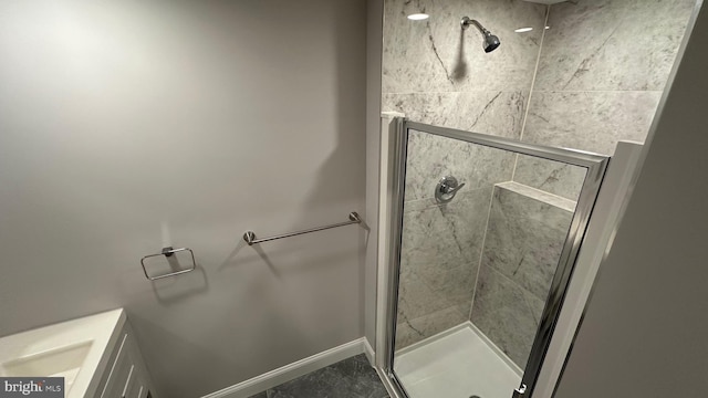 bathroom with a shower with door and tile patterned flooring