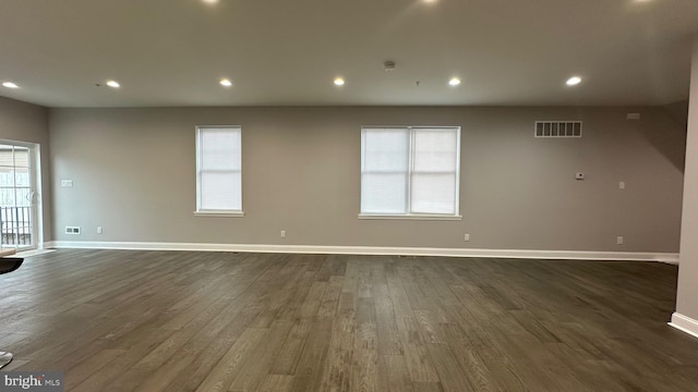 empty room featuring dark wood-type flooring