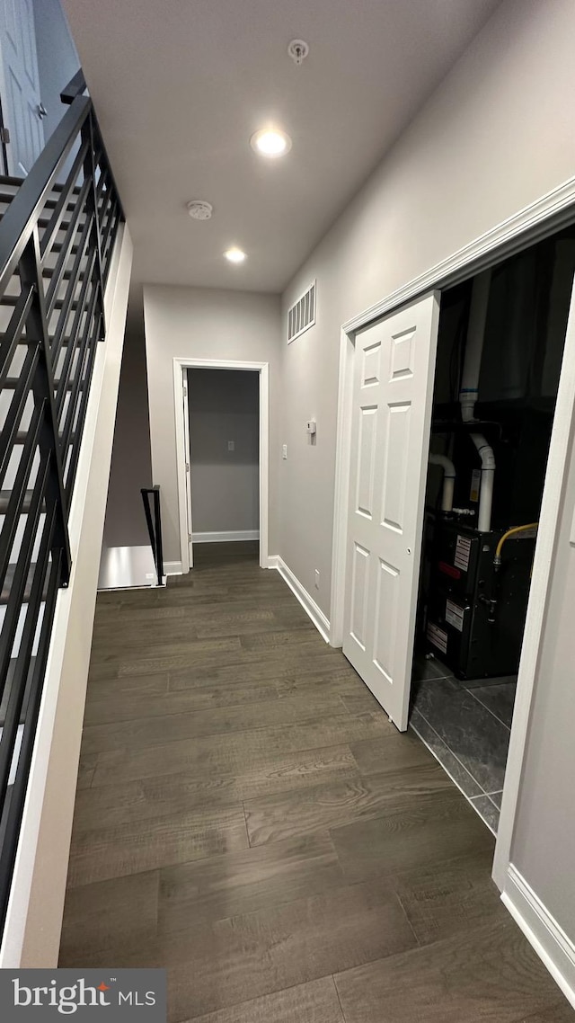 corridor featuring dark hardwood / wood-style flooring