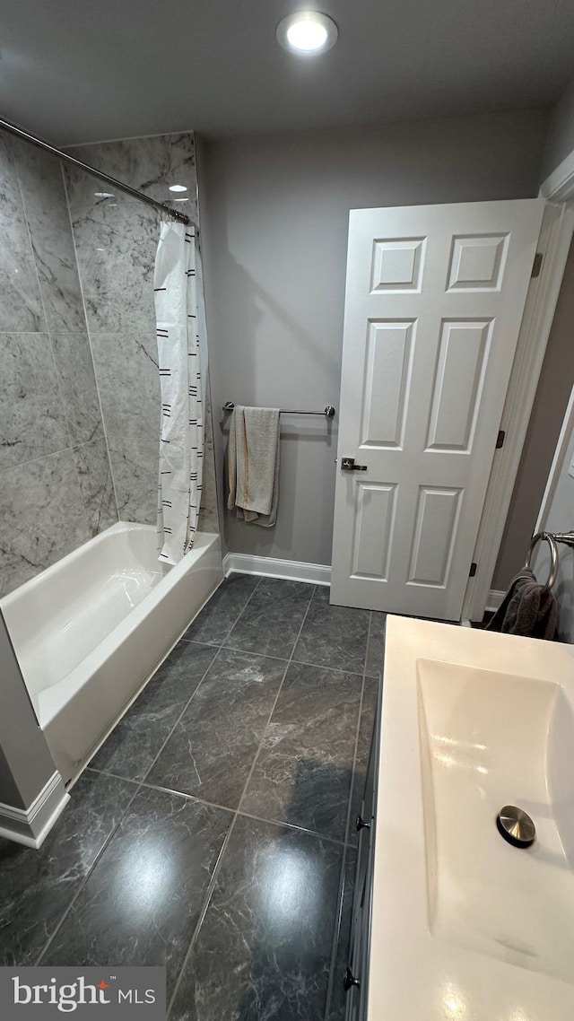 bathroom featuring shower / tub combo with curtain and vanity