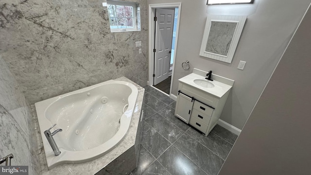 bathroom featuring vanity and a relaxing tiled tub