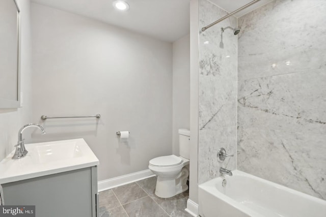 full bathroom featuring tiled shower / bath combo, vanity, tile patterned flooring, and toilet