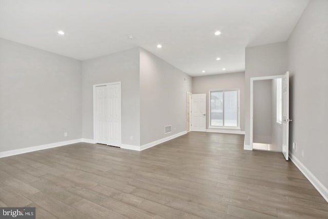 unfurnished room with light wood-type flooring