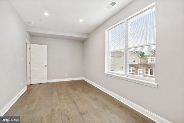 unfurnished room featuring light hardwood / wood-style flooring