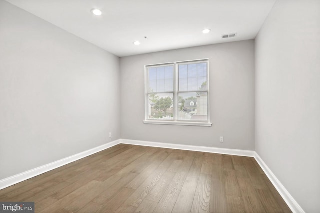 empty room featuring hardwood / wood-style flooring