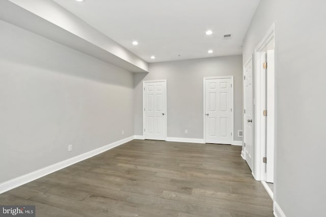 basement featuring dark hardwood / wood-style floors