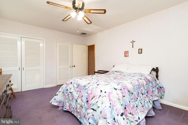 carpeted bedroom with multiple closets and ceiling fan