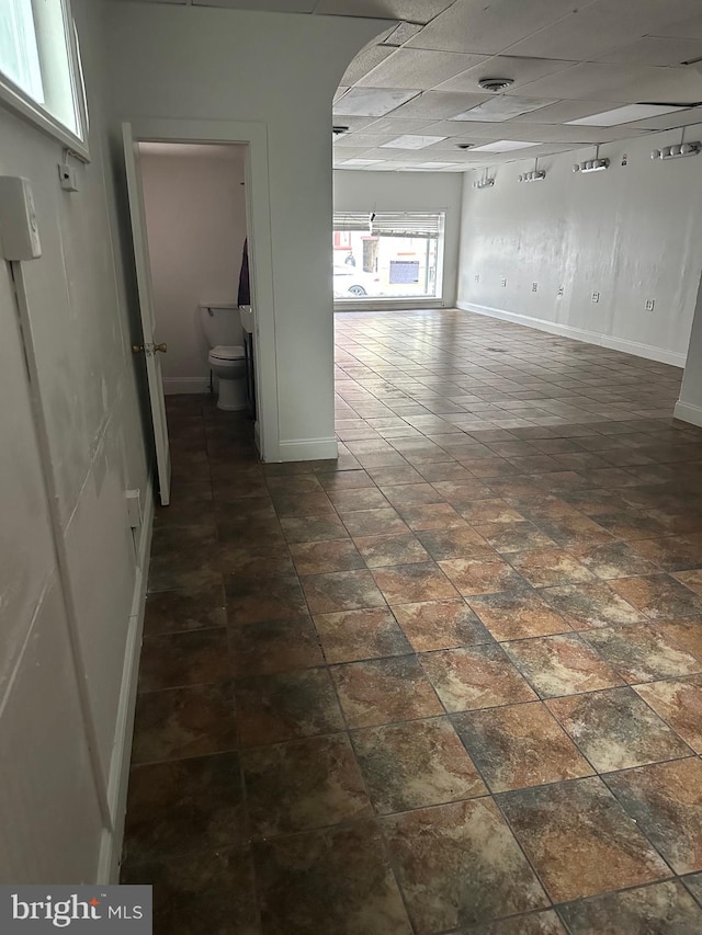 unfurnished room with a paneled ceiling