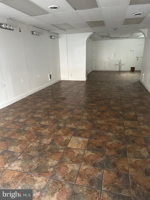 basement featuring a drop ceiling