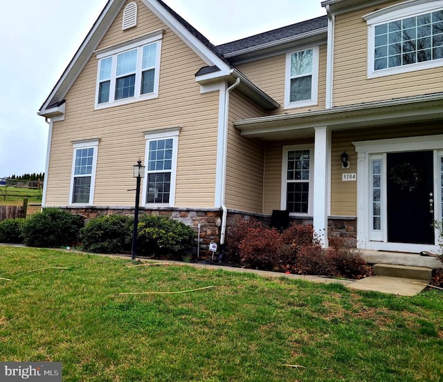 exterior space featuring a front yard