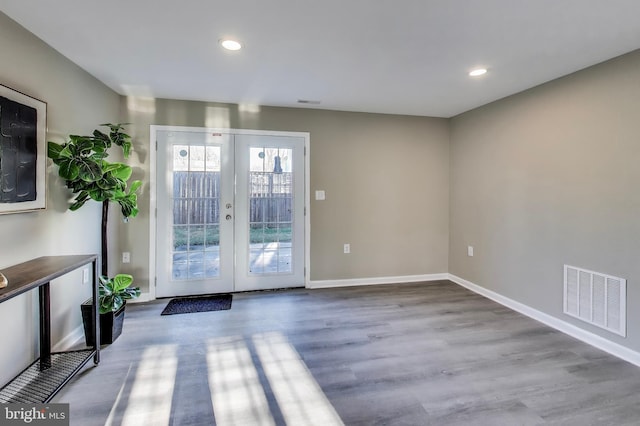 doorway to outside featuring french doors and hardwood / wood-style floors