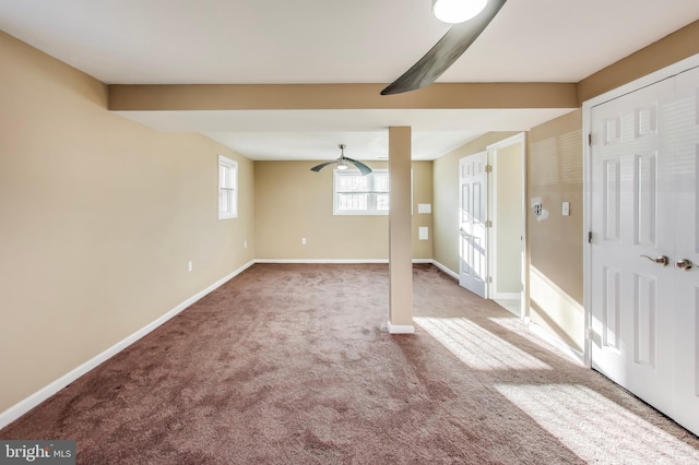 interior space featuring ceiling fan and carpet