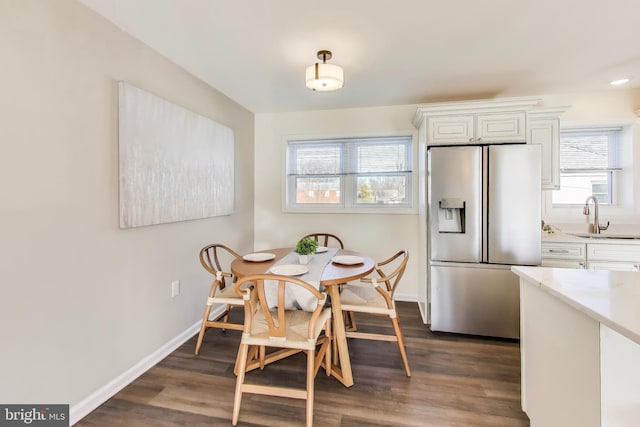 dining room featuring dark hardwood / wood-style floors and sink