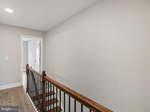 corridor featuring dark hardwood / wood-style floors