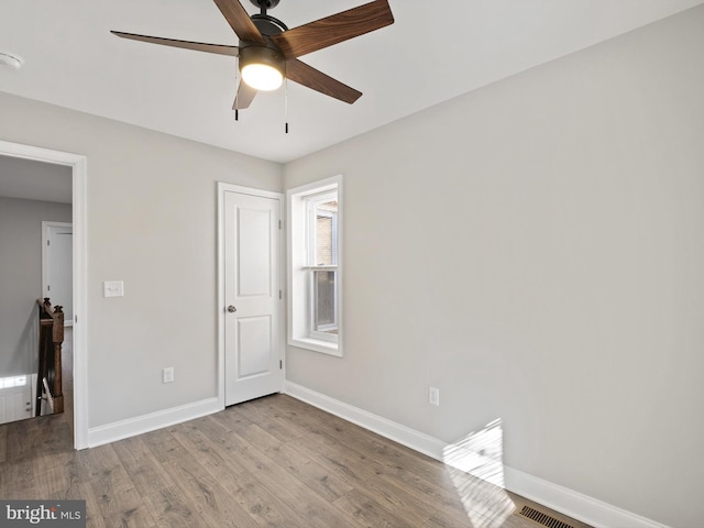 unfurnished bedroom with ceiling fan and light hardwood / wood-style flooring