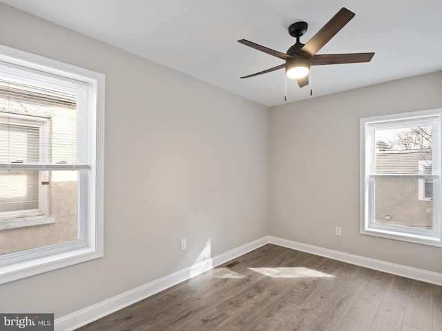 unfurnished room featuring wood-type flooring and ceiling fan