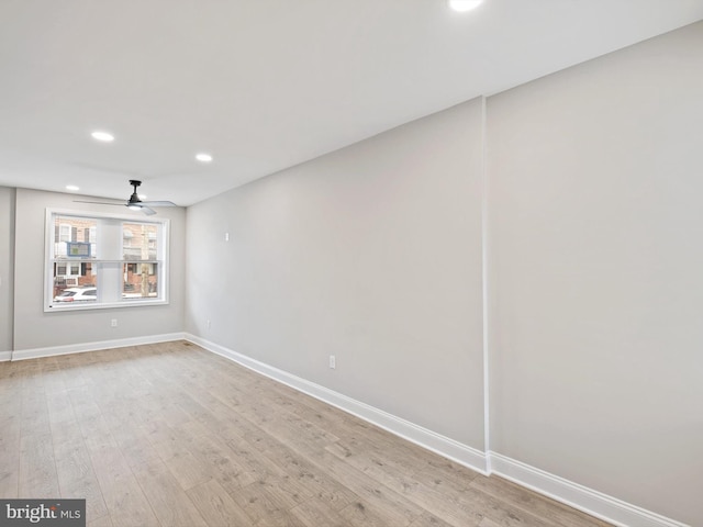 unfurnished room with ceiling fan and light hardwood / wood-style flooring