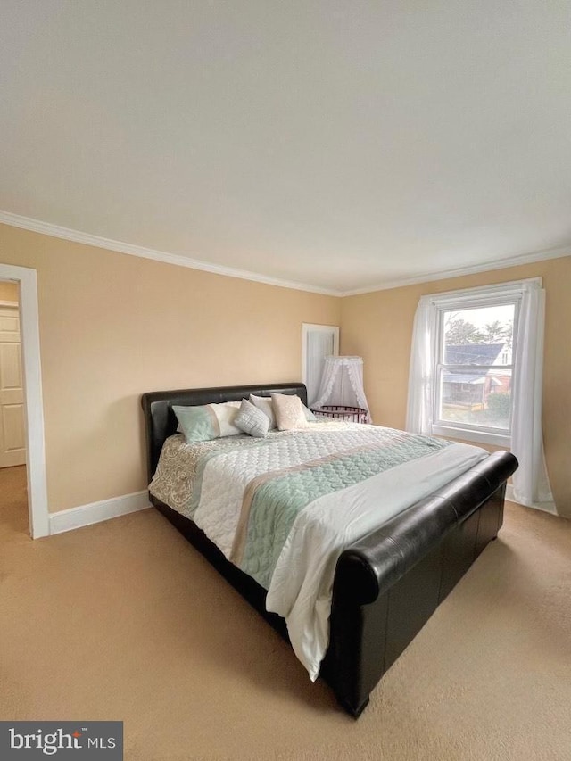 bedroom featuring ornamental molding and light carpet