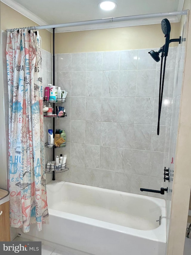 bathroom featuring crown molding and shower / tub combo