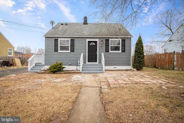 bungalow-style house with a patio