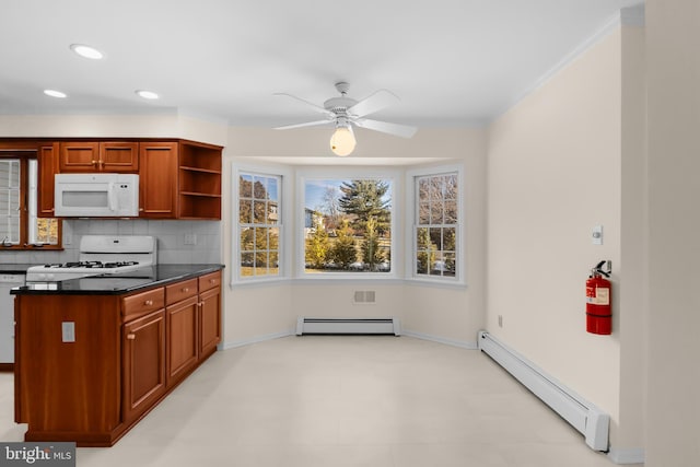 kitchen with ceiling fan, white appliances, a baseboard radiator, and decorative backsplash