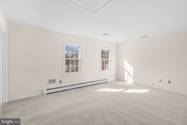 unfurnished room with baseboard heating and light colored carpet