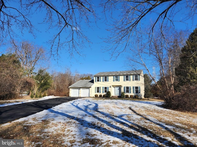 view of front of property featuring an attached garage and driveway