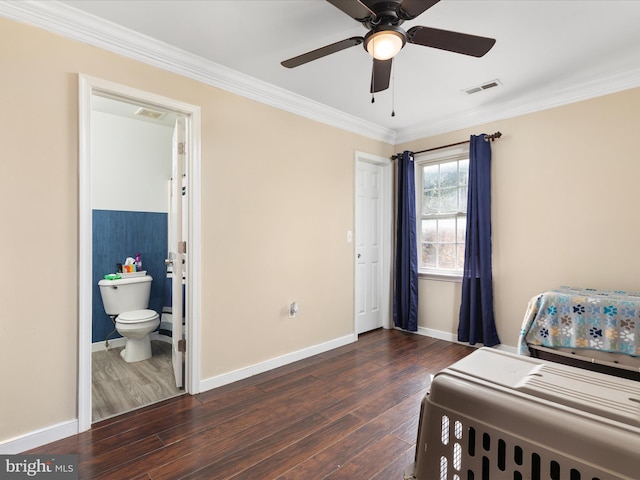 bedroom with dark wood-type flooring, ceiling fan, connected bathroom, and crown molding