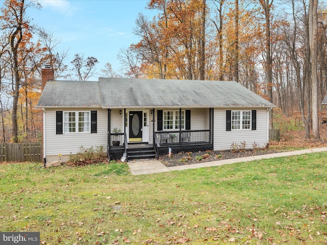 ranch-style home with a front yard and a porch