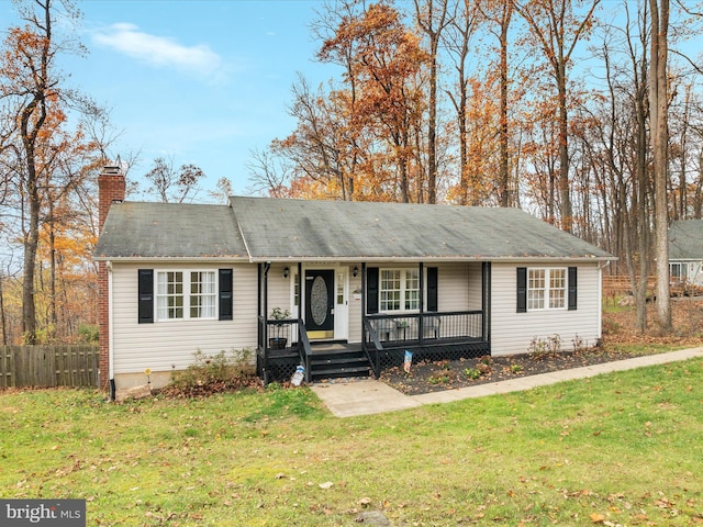 ranch-style house with a porch and a front yard