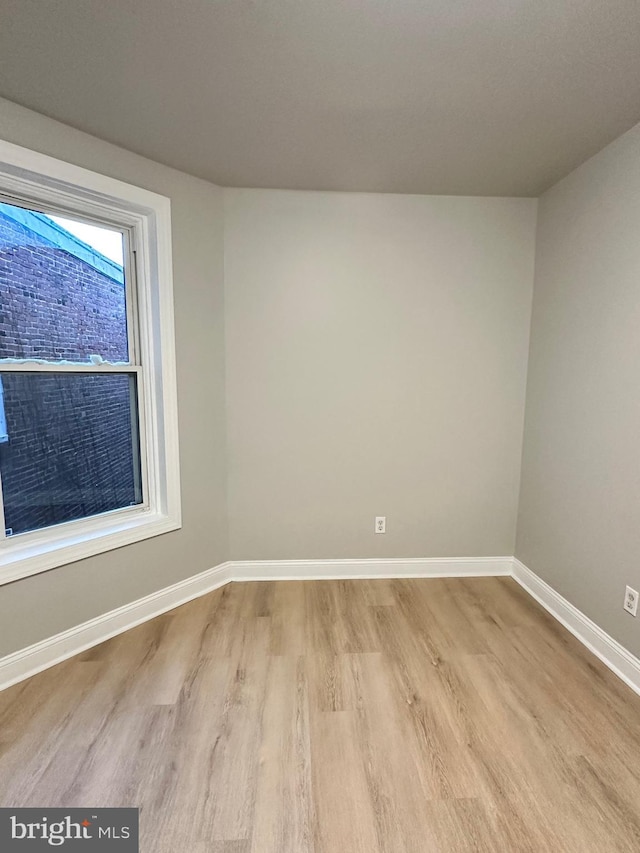 spare room with light hardwood / wood-style floors