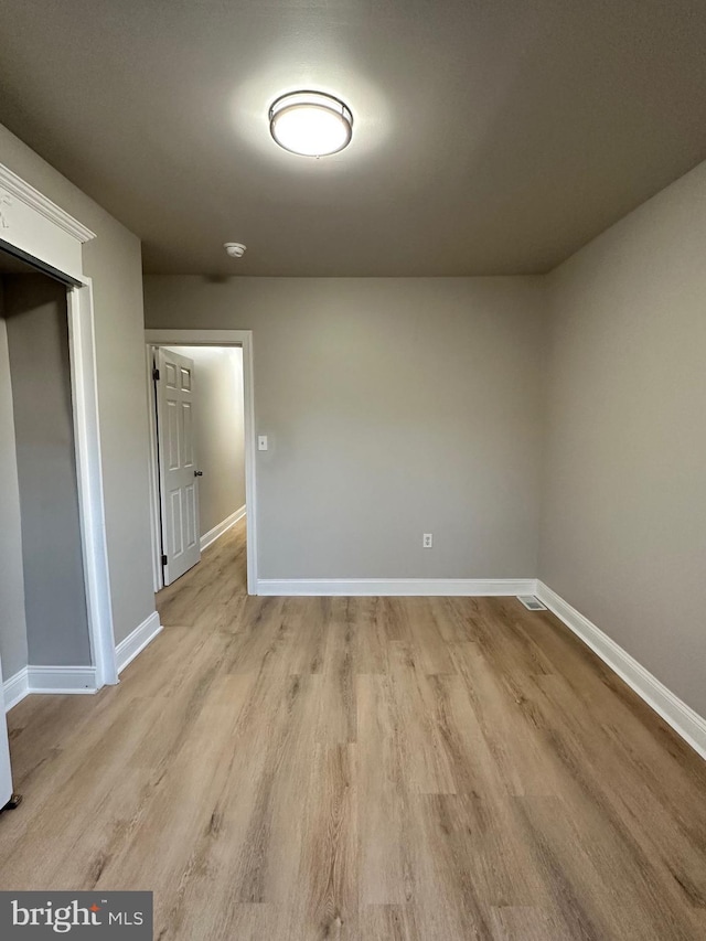 empty room with light wood-type flooring