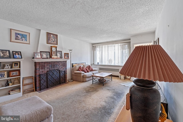 carpeted living room featuring radiator, a textured ceiling, and a brick fireplace