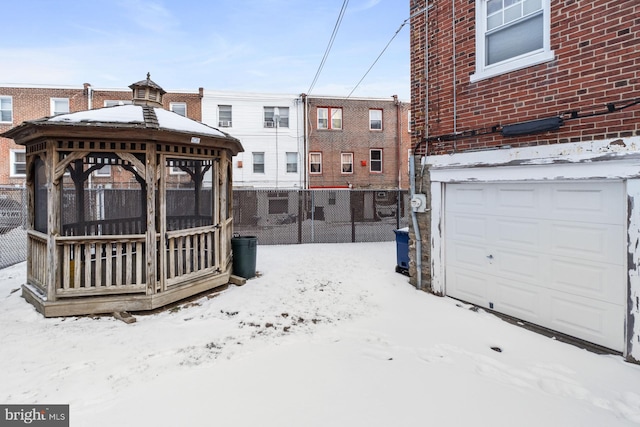 exterior space featuring a garage and a gazebo