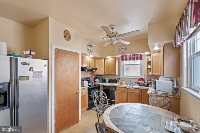 kitchen featuring ceiling fan, sink, decorative backsplash, and black appliances