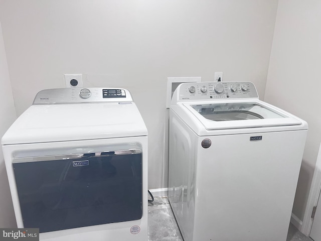 laundry room featuring separate washer and dryer