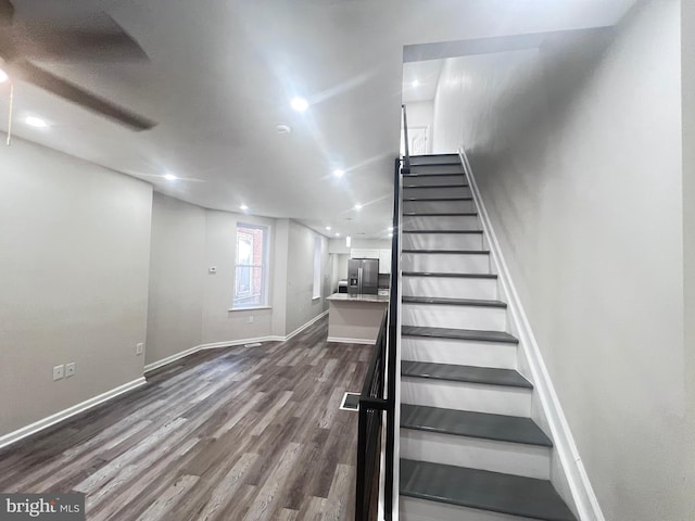 stairs with wood-type flooring