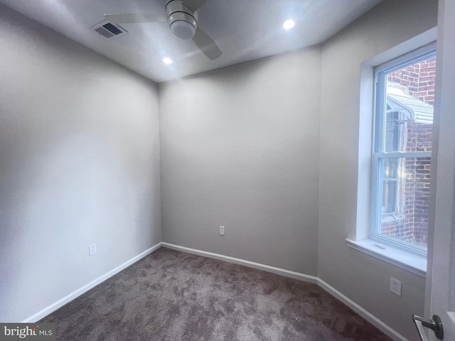 empty room featuring carpet and ceiling fan