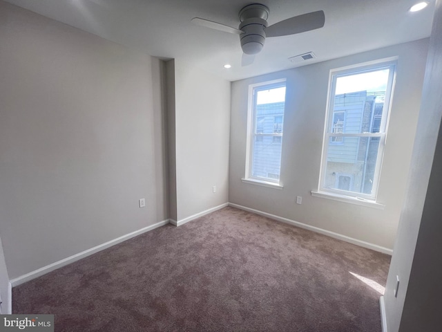 unfurnished room featuring carpet floors and ceiling fan