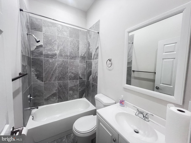 full bathroom with vanity, toilet, and tiled shower / bath combo