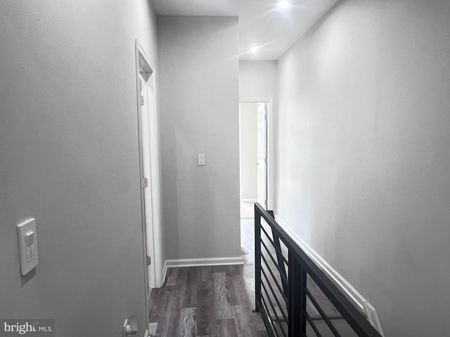 corridor featuring dark wood-type flooring