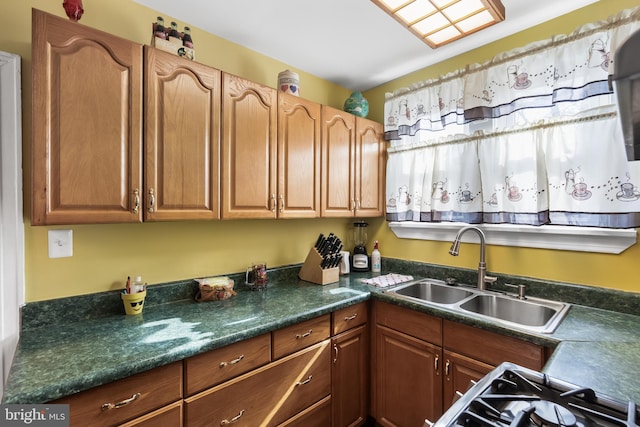 kitchen featuring sink and range with gas cooktop