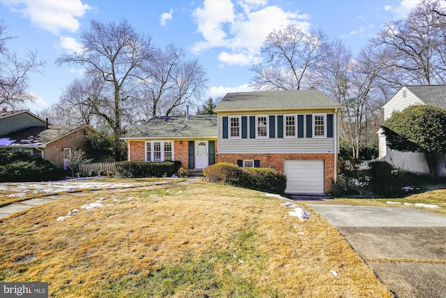 view of front facade with a garage and a front lawn