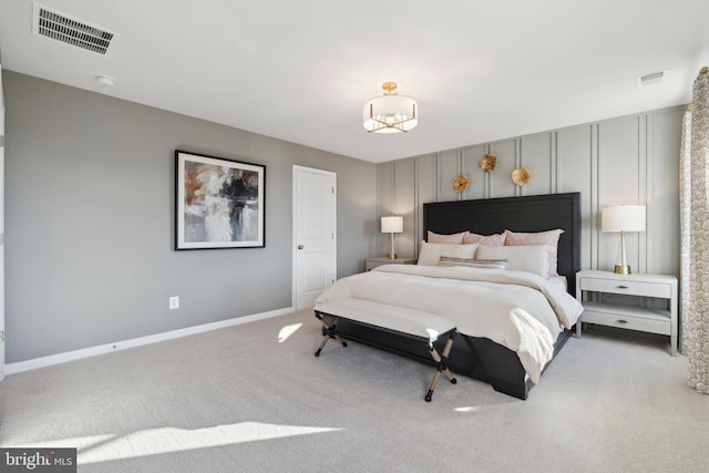 bedroom with light colored carpet