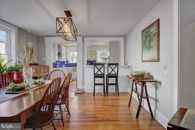 dining space with light wood-type flooring