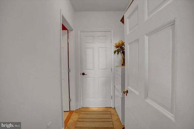 entryway featuring light tile patterned flooring