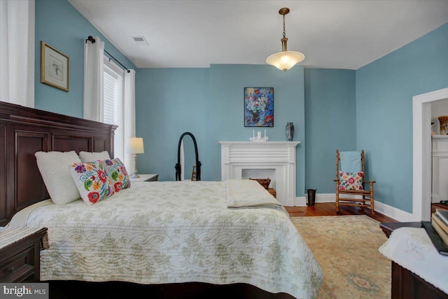 bedroom featuring wood-type flooring